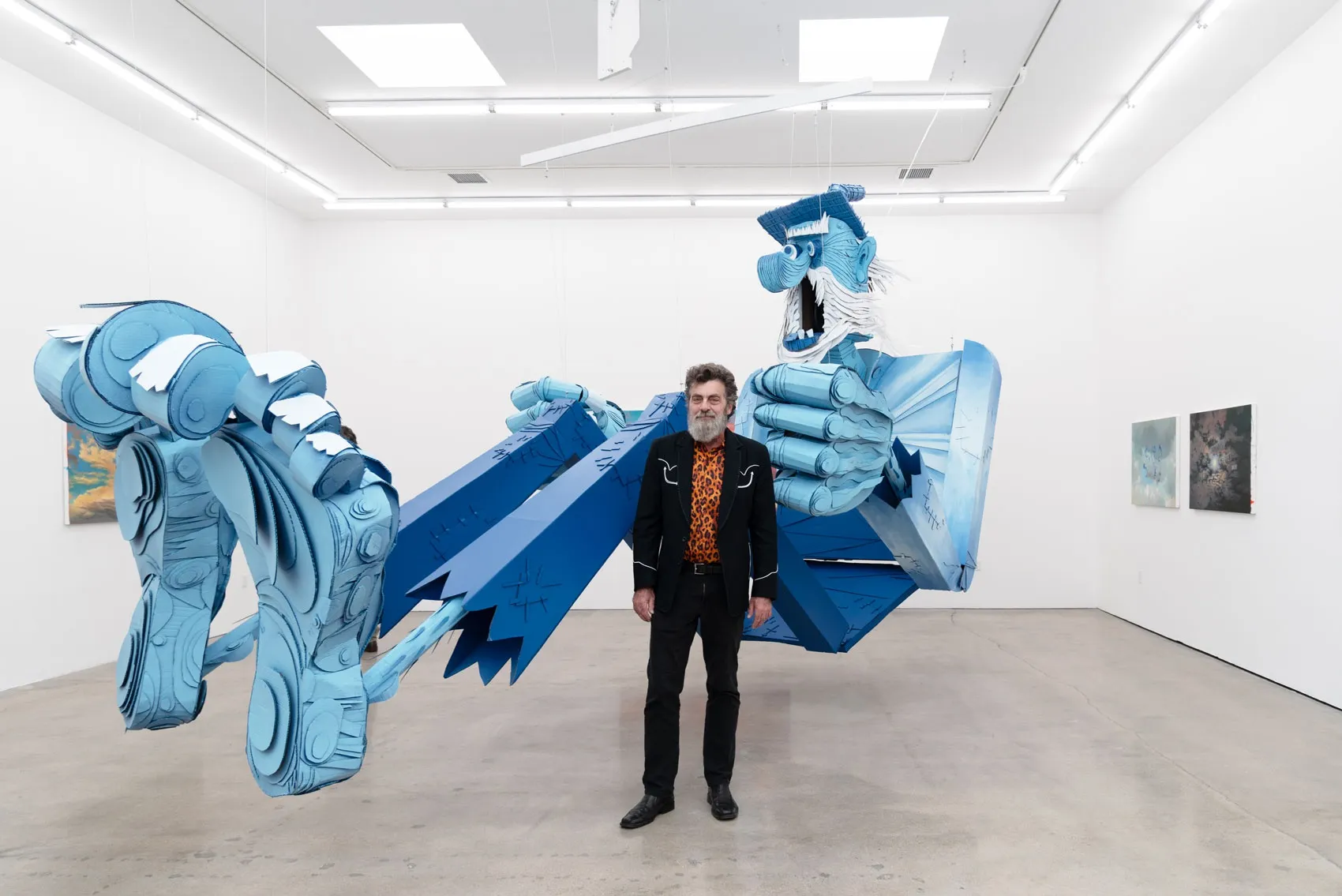 Artist Wayne White in front of his puppet at Hashimoto Contemporary Los Angeles