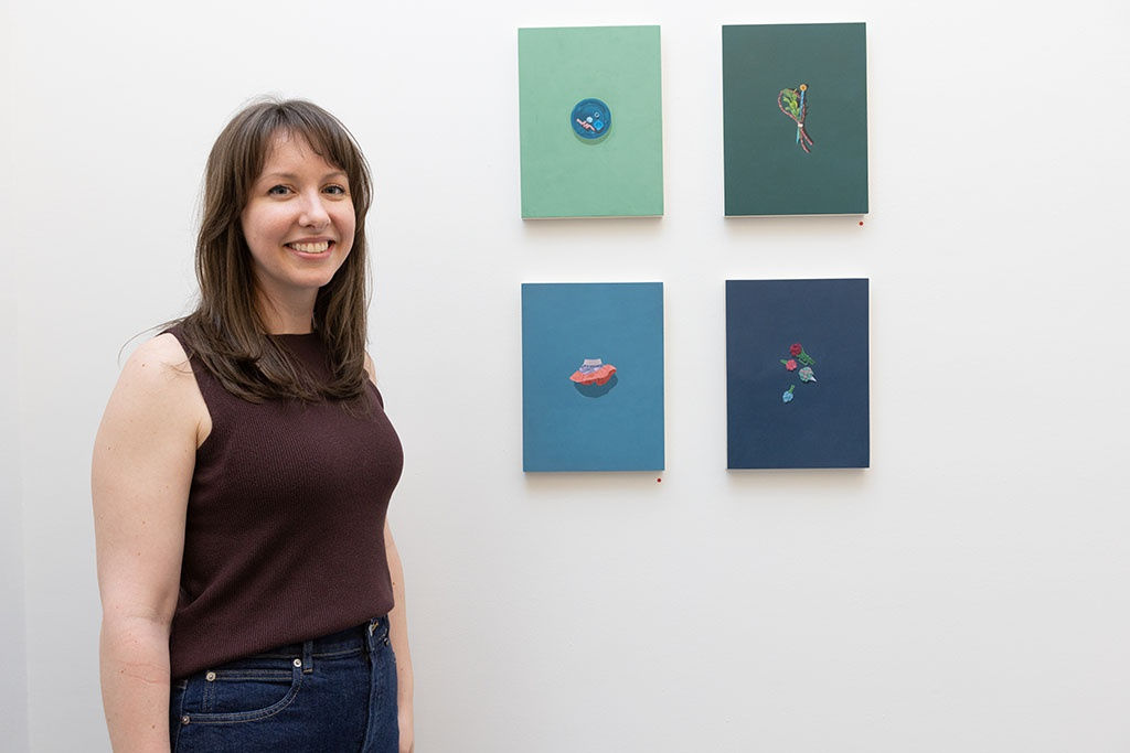 Artist Katie Berka with her work