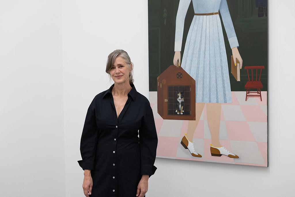 Artist Angela Burson in front of her work