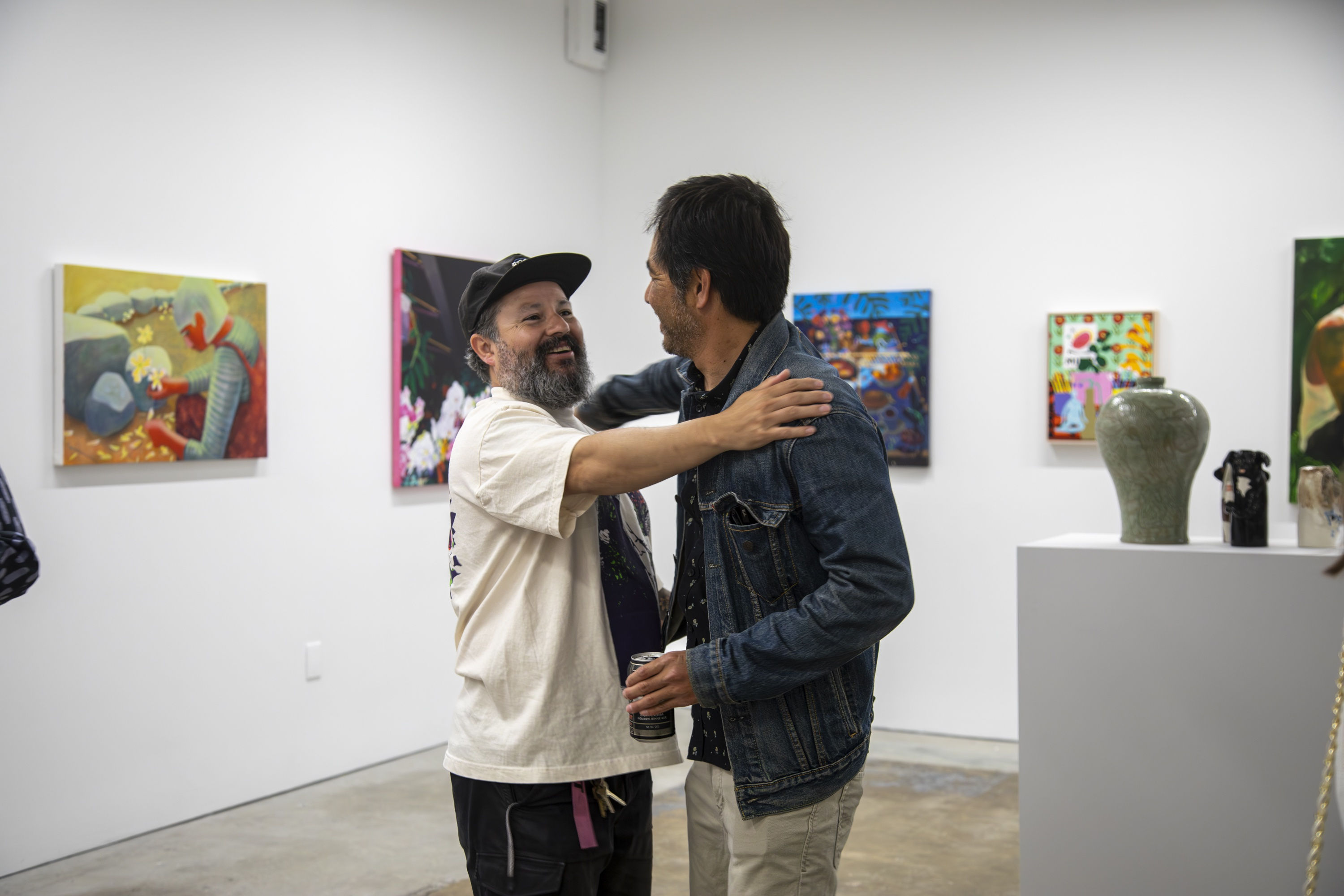 Hector Esqueda and Kim Cogan bring it in for a huge in the art gallery with concrete floors and dim fluorescent lighting.