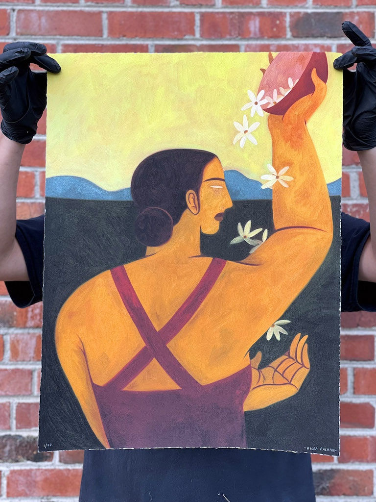 Person holding up Hilda Palafox print