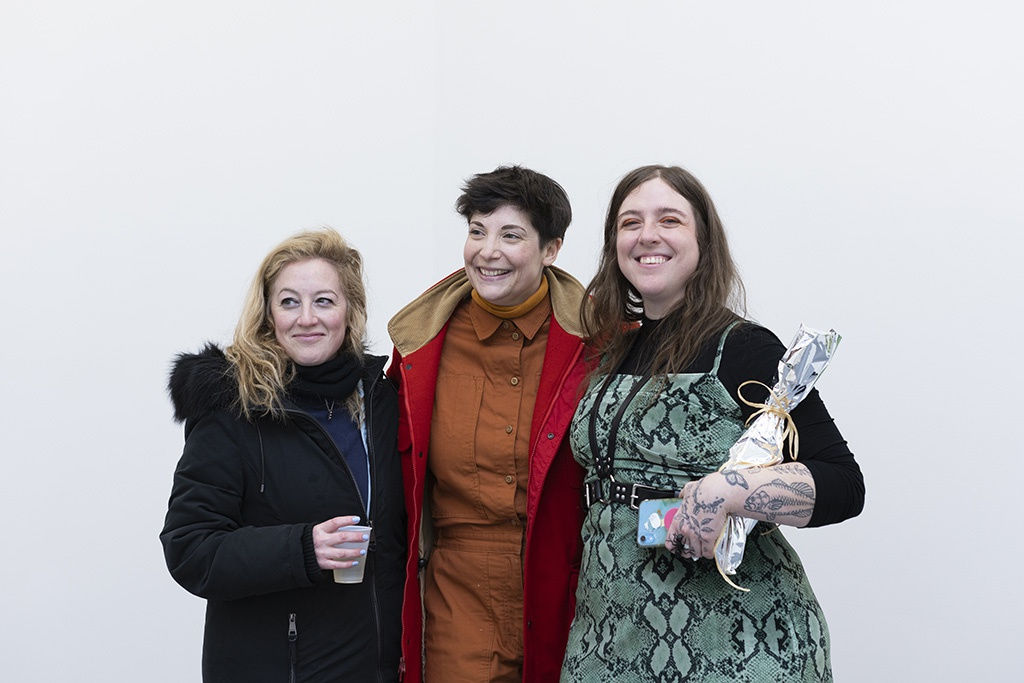 artist Nic Dyer standing with two friends 