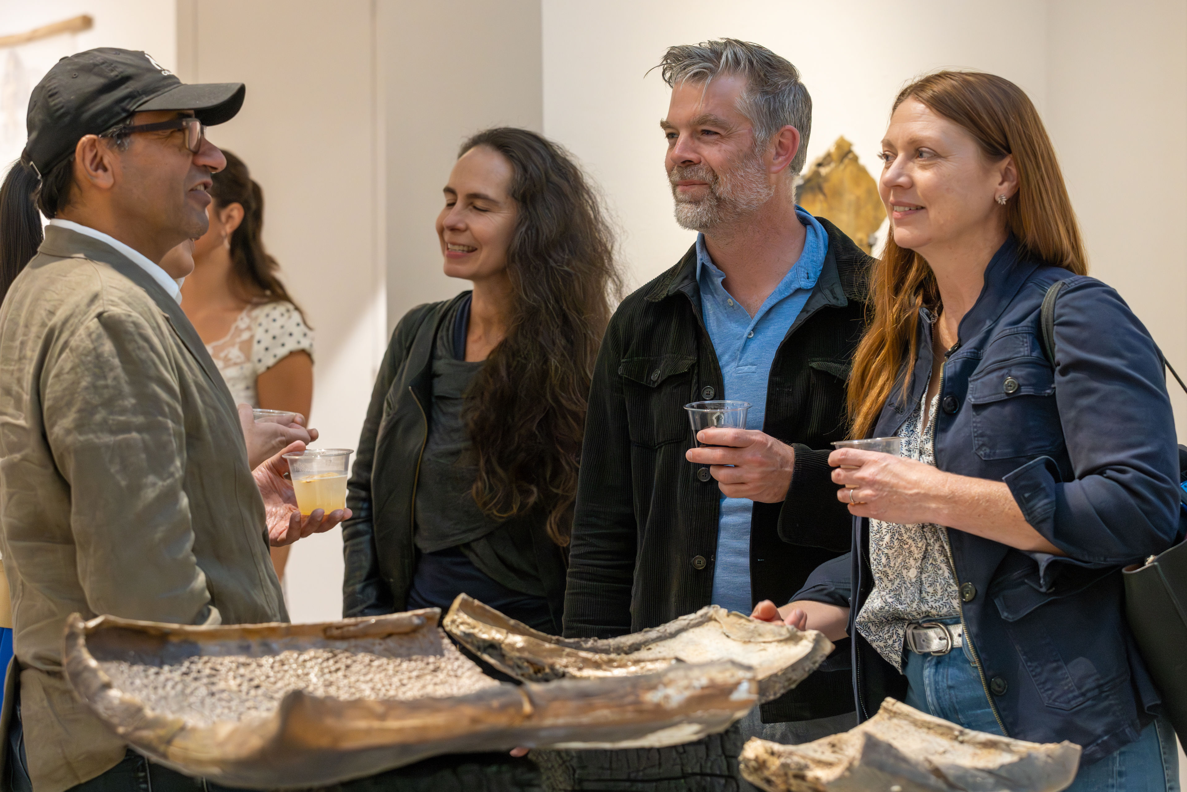 Folks talking over art