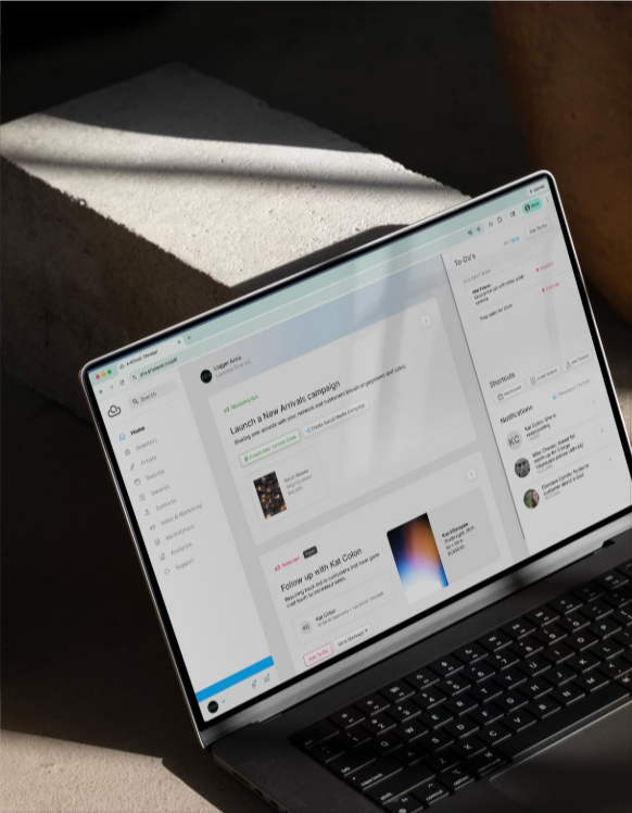 A photo of a laptop with a browser window open on Artlogic's webpage