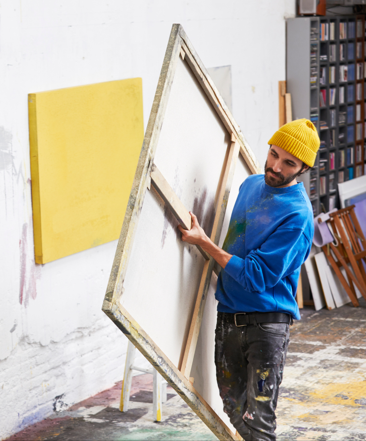 Artist carrying a canvas