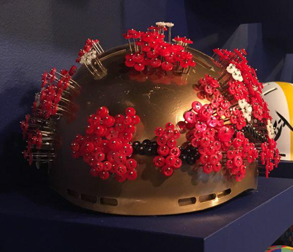 Passion Flower PC, 2018, Buttons and pins on gold painted helmet