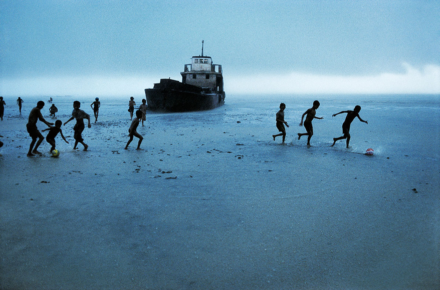Steve McCurry, Impromptu soccer match, Sittwe, Burma/Myanmar, 1995, Ultrachrome print