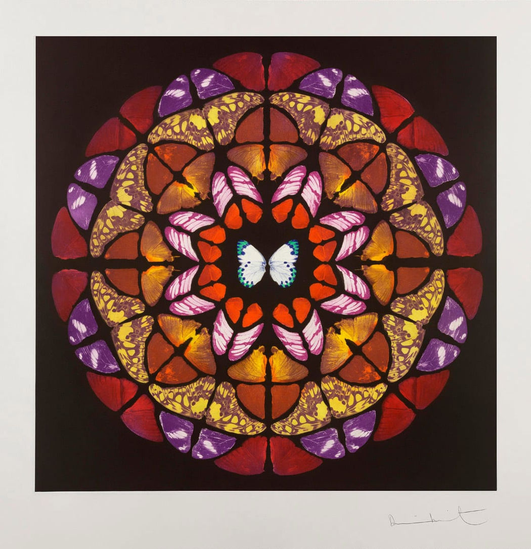 Altar, Damien Hirst. It features an intricate, symmetrical, kaleidoscopic pattern composed of real butterfly wings, arranged in concentric circles.