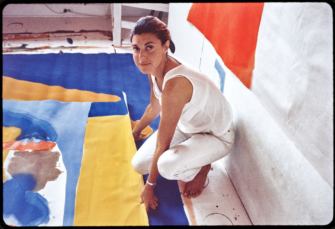 Helen Frankenthaler in her studio “in the woods” in Provincetown, 1968. Working on the floor, she poured thinned paint directly onto raw, unprimed canvas, a technique that established the Color Field movement. Credit: Helen Frankenthaler Foundation, Inc./Artists Rights Society (ARS), New York; J. Paul Getty Trust; via Alexander Liberman Photography Archive; Getty Research Institute