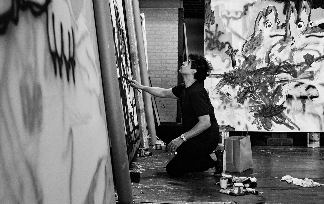 Portrait of Robert Nava painting in his studio, photography by Axel Dupeux