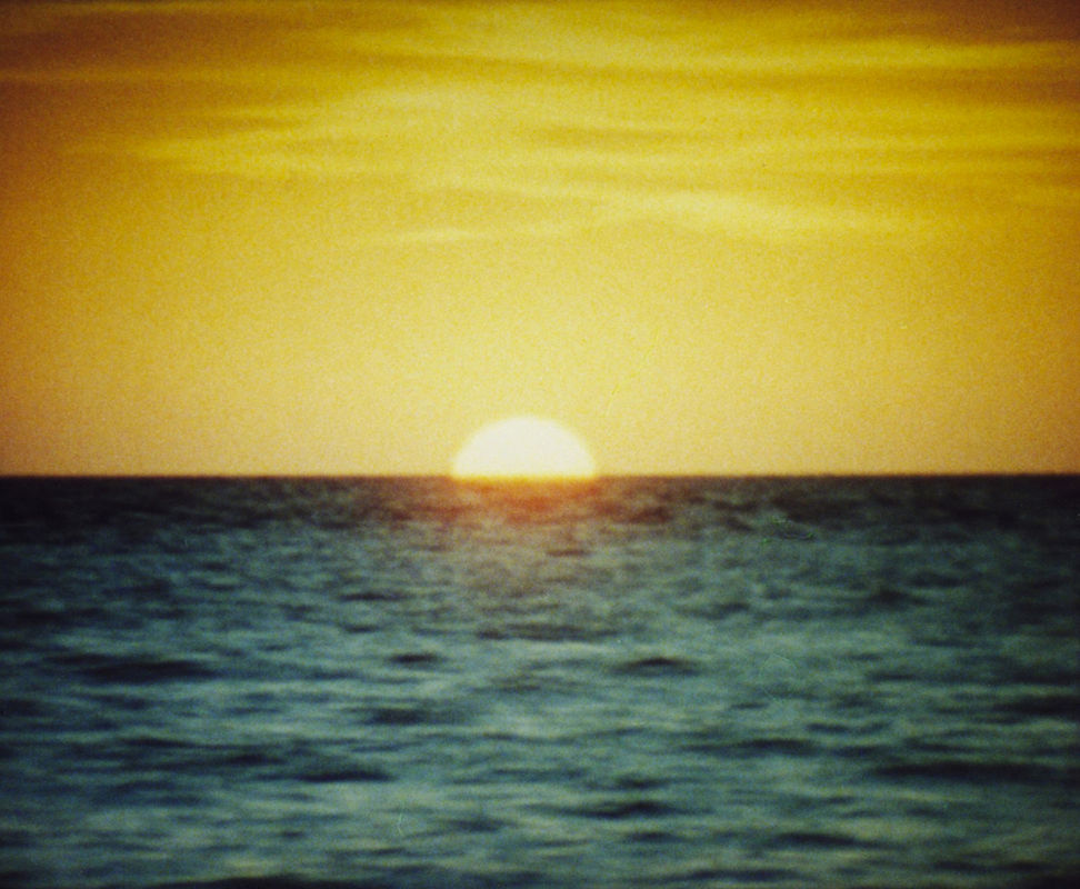 A still of a sunset from a film by Tacita Dean