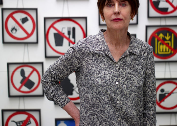 Artist Annette Messager in front of work.