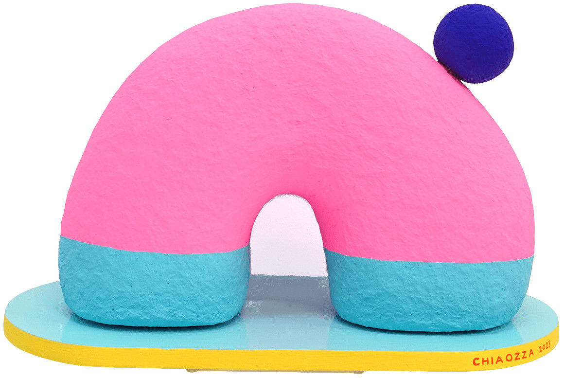 semi-circle pink sculpture with a dark blue sphere on its right side