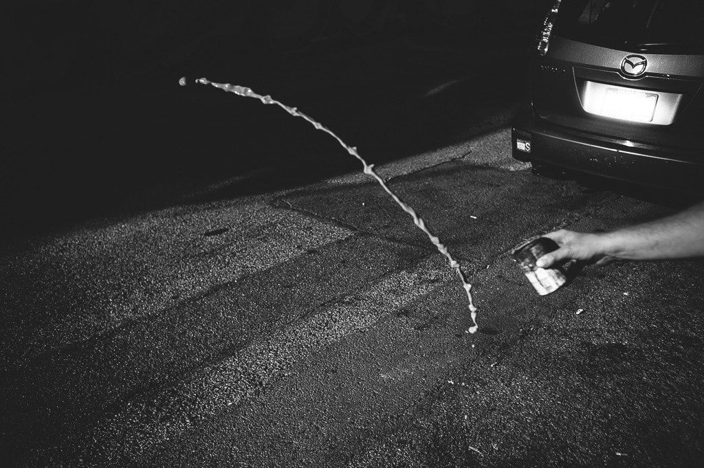 Shaun Roberts photo of water being tossed on sidewalk