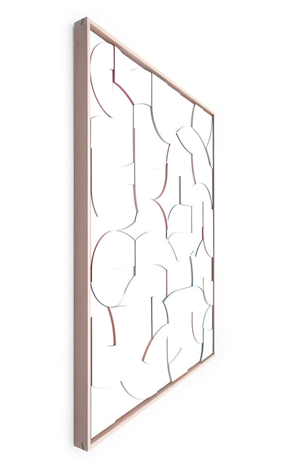 Side view of a framed all white wood relief sculptural piece made up of spiral shapes and curves by artist Scott Albrecht
