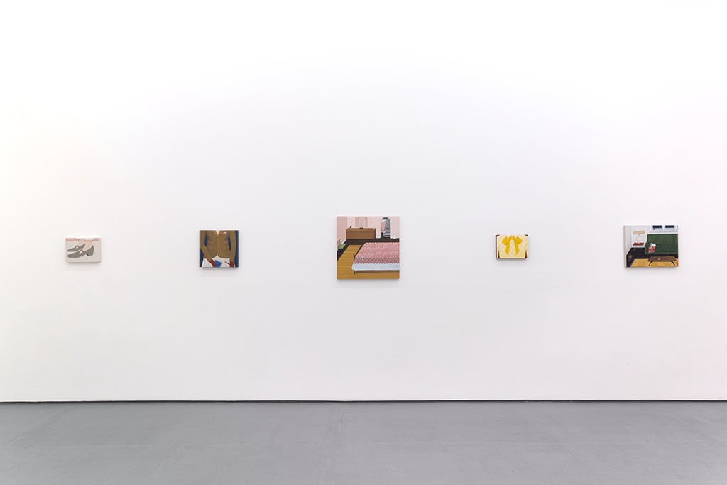 White gallery walls with paintings of various sizes by Angela Burson