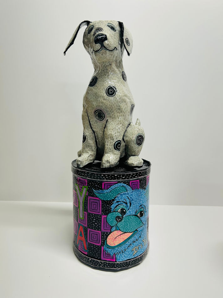Mark Gagnon - sculptures of a black and white dog sitting and a can with the image of a dog head and the text 