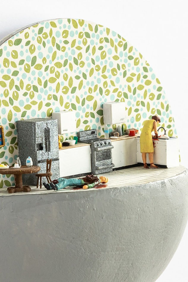 mini scene of a woman killing her husband in a kitchen