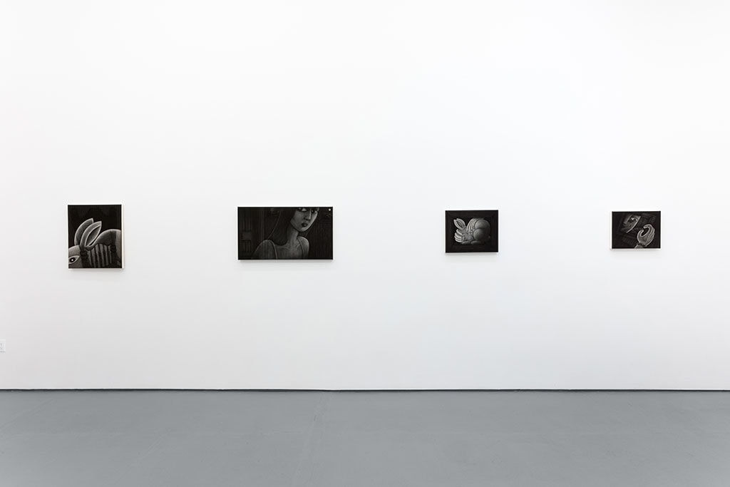 white gallery wall with four greyscale paintings by Angela Fang Zirbes