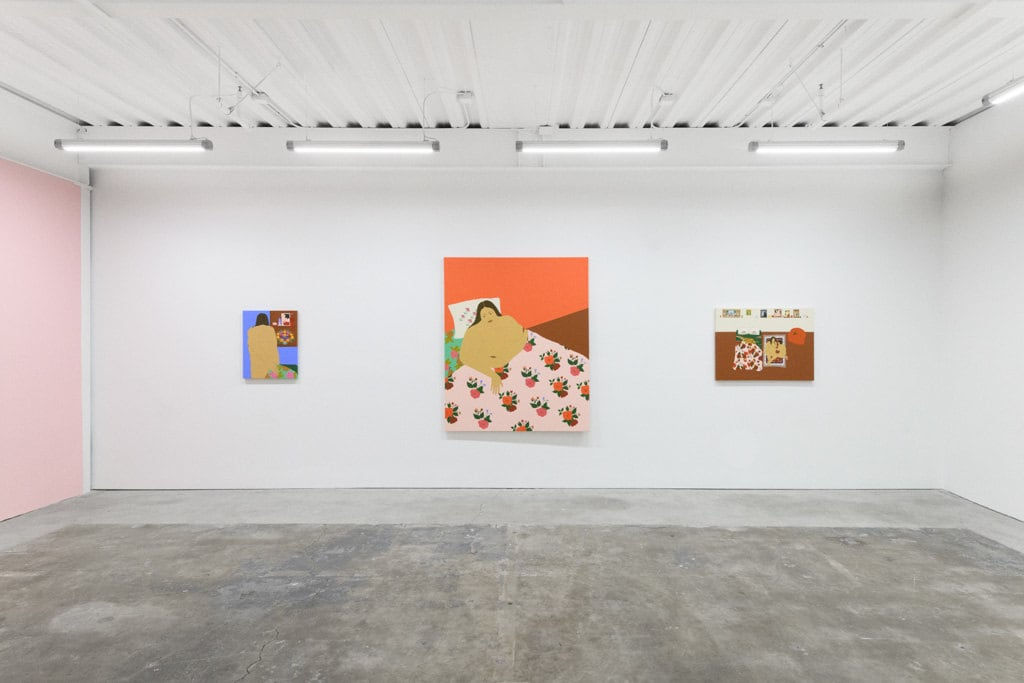 installation of Gina M. Contreras exhibition - white wall with three paintings of nude female figures. From left to right: 