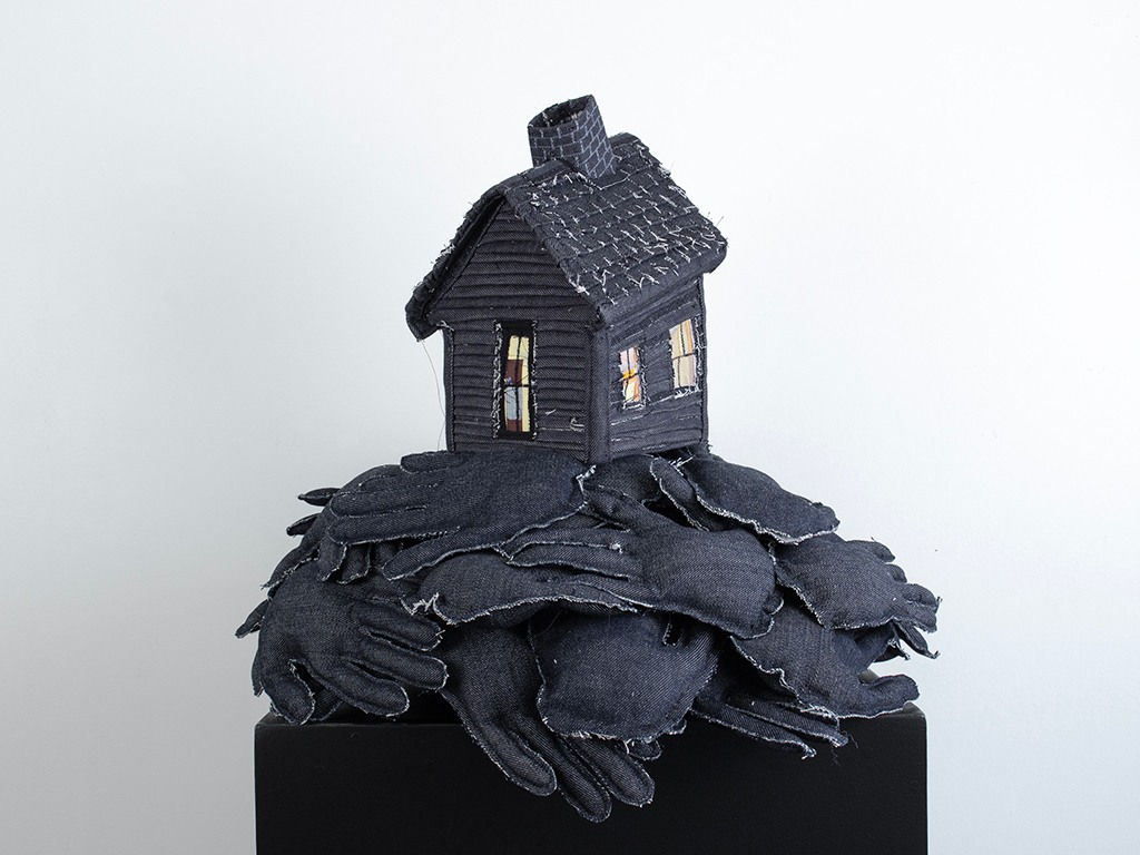 Tania Alvarez sculpture of house on bed of hands