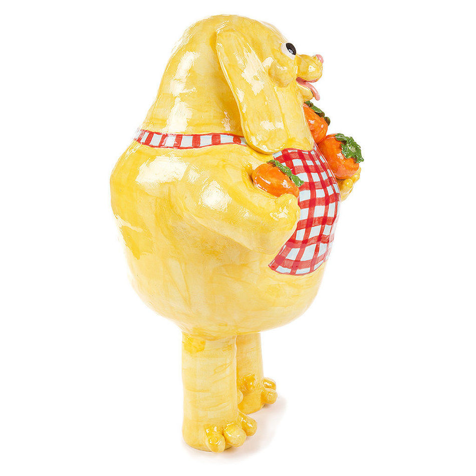 Katie Kimmel's ceramic sculpture of a dog holding fruit in a red checkered apron