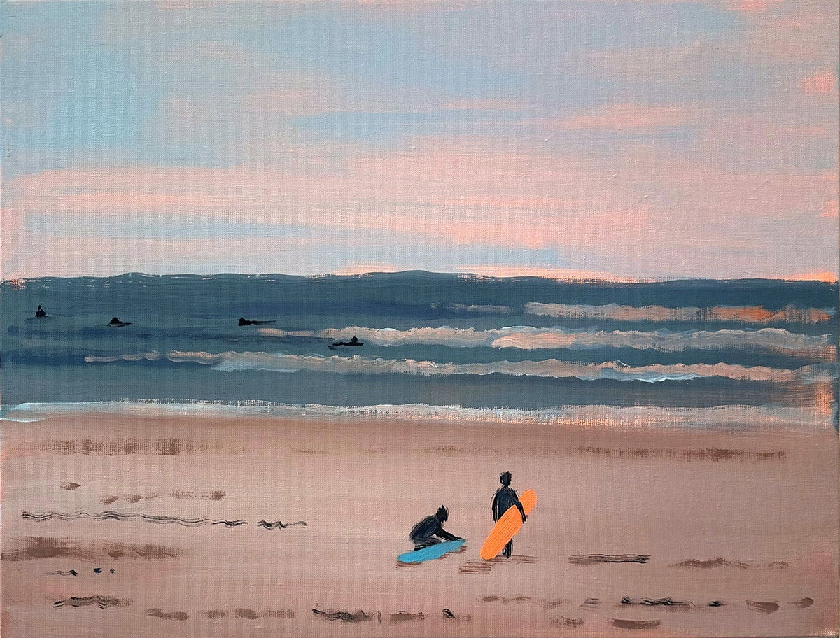 two people holding surfboards standing on the beach