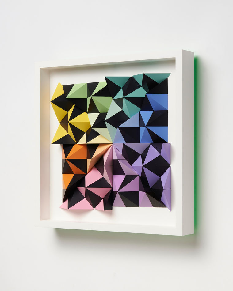 wooden wall sculpture with rainbow colors
