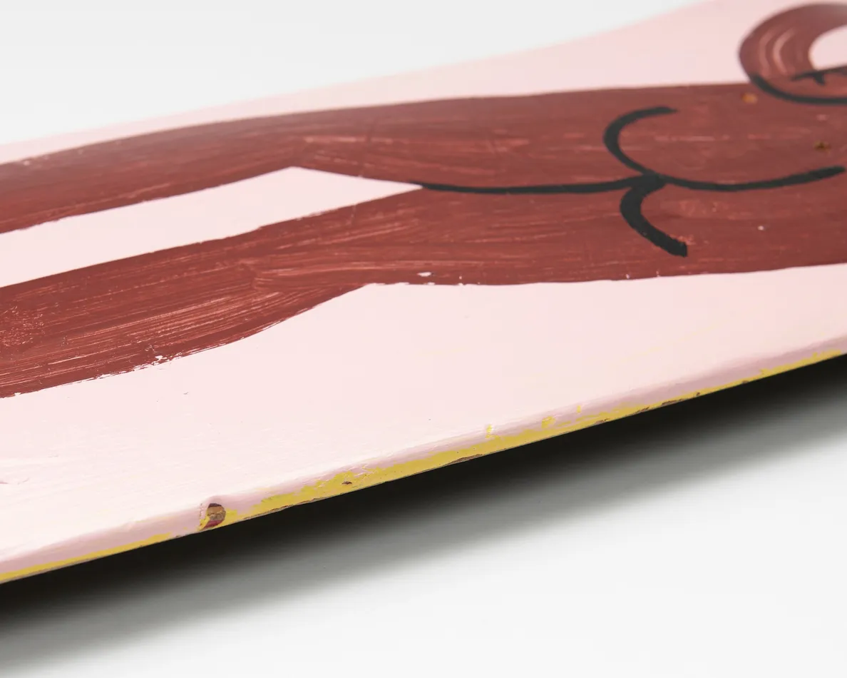 skateboard deck with nude figure on pink background