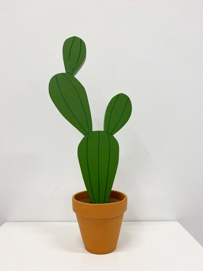 Jeff Canham wooden plant sculpture in a terra cotta pot