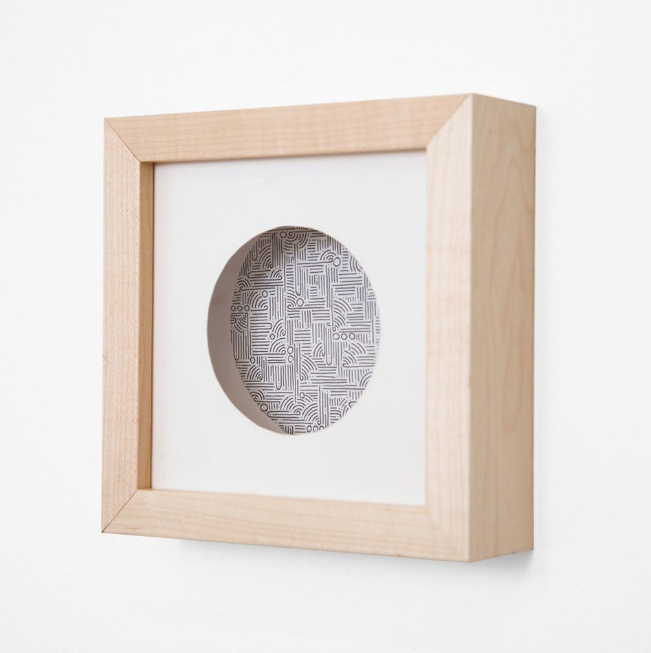 Aaron de la Cruz abstract round painting in natural frame