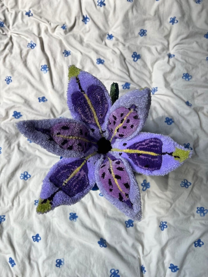 top of Shishi San sculpture - purple flower visible