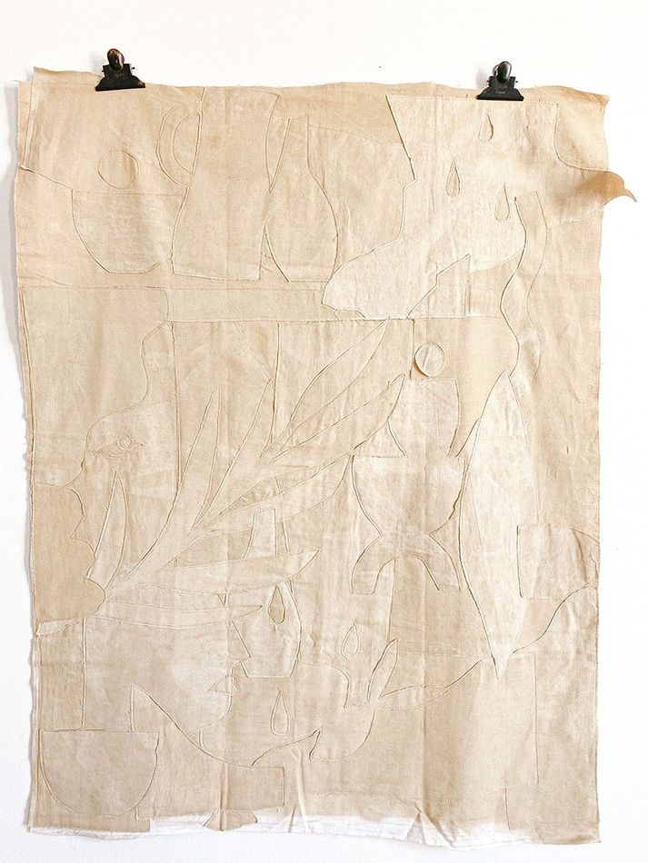 cream linen cloth embroidered with the shape of plants and vases