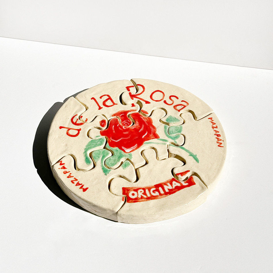 Ceramic sculpture of a de la Rosa mazapan cut into a puzzle