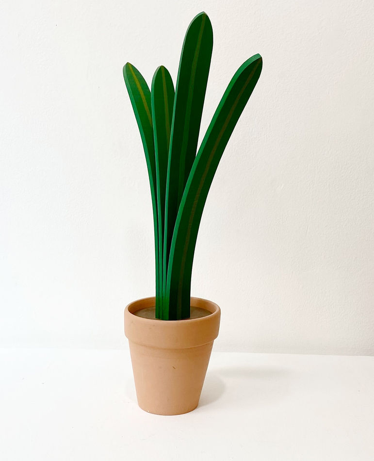 Jeff Canham wooden plant sculpture in a terra cotta pot