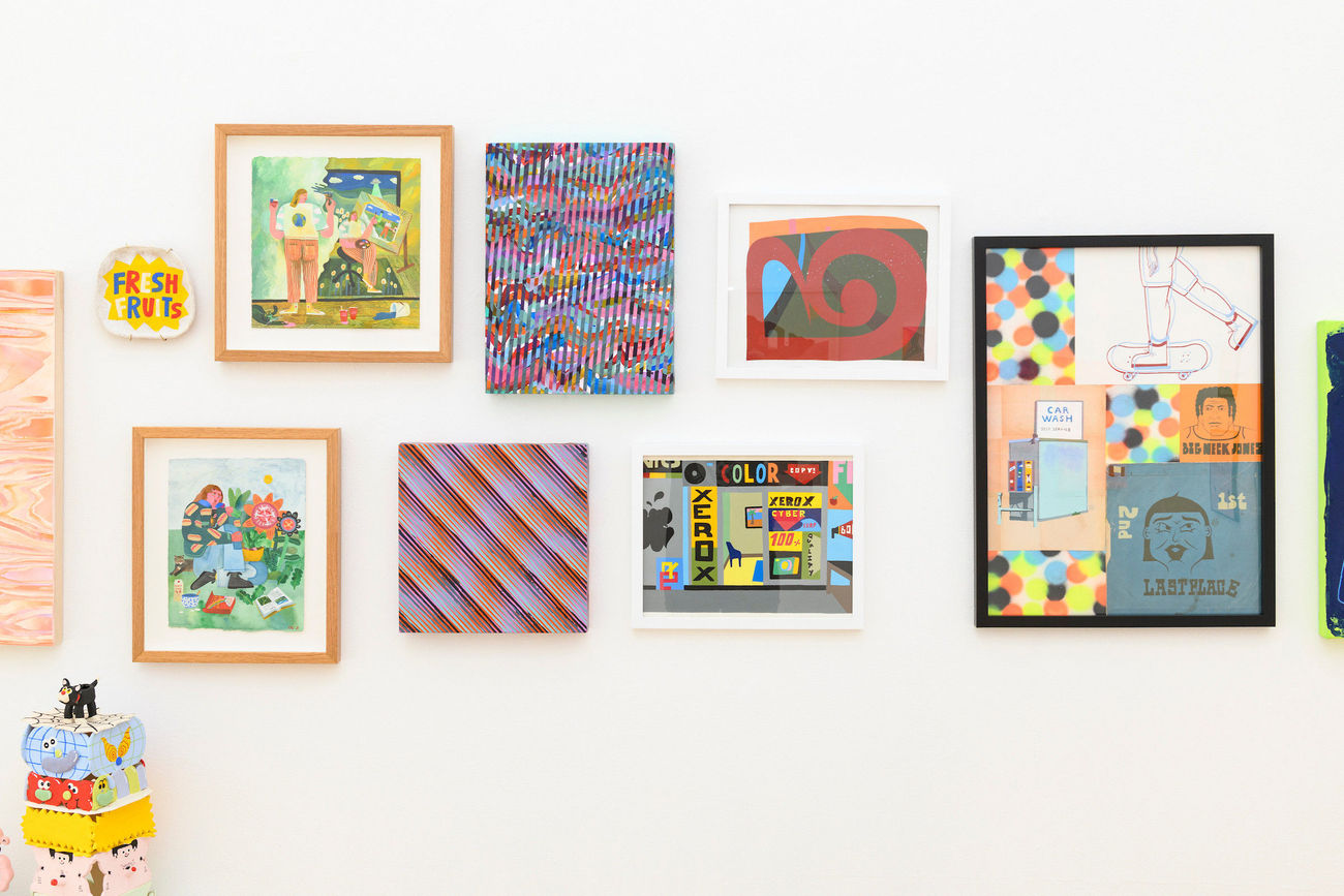 various paintings hanging on the walls at Friends & Family