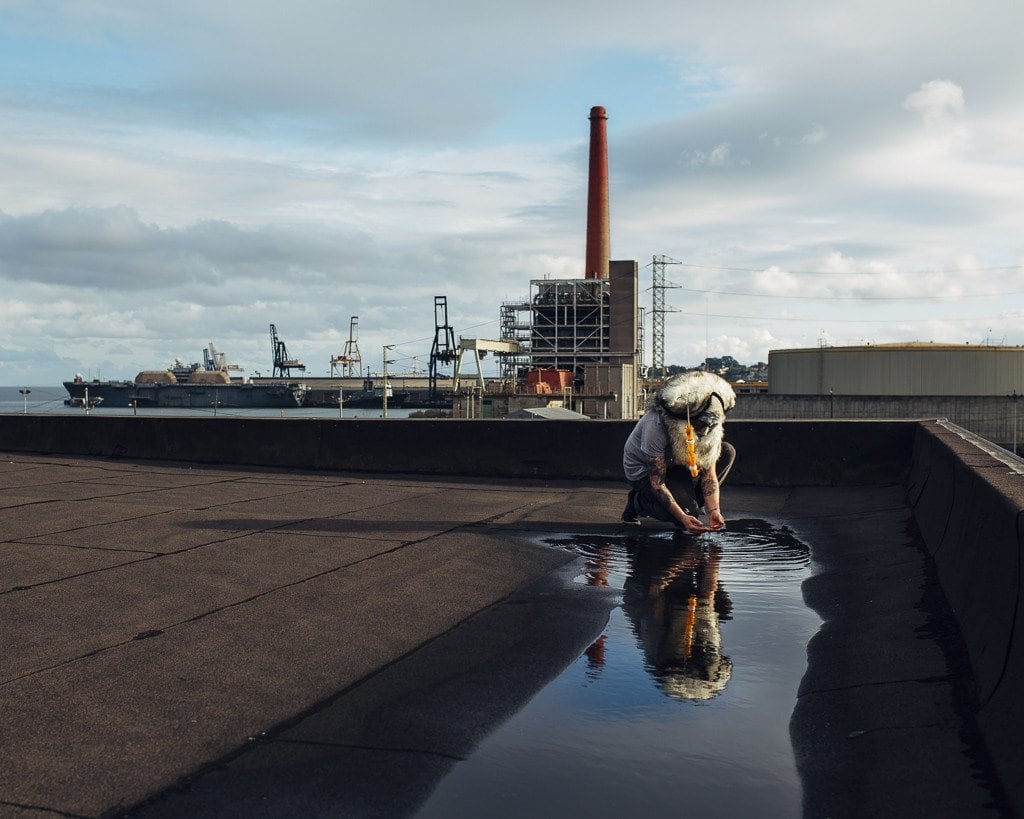 Shaun Roberts photo of figure with headress on rooftop