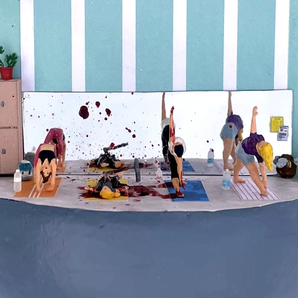 bleeding woman with an axe through her back in the middle of an active yoga class