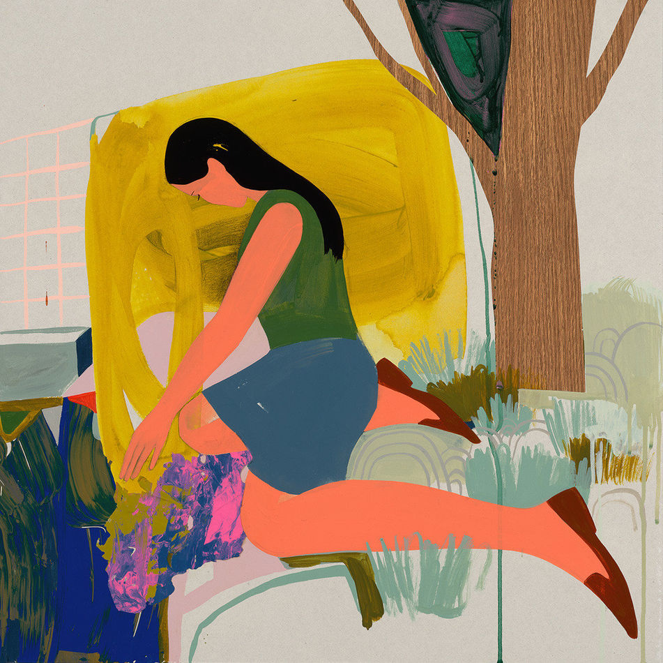 a woman kneeling on the ground with a large yellow shape behind her