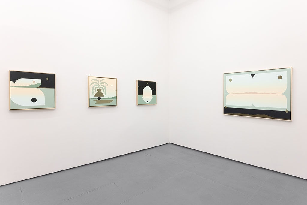 White gallery with four paintings in blue, black, and warm toned colors
