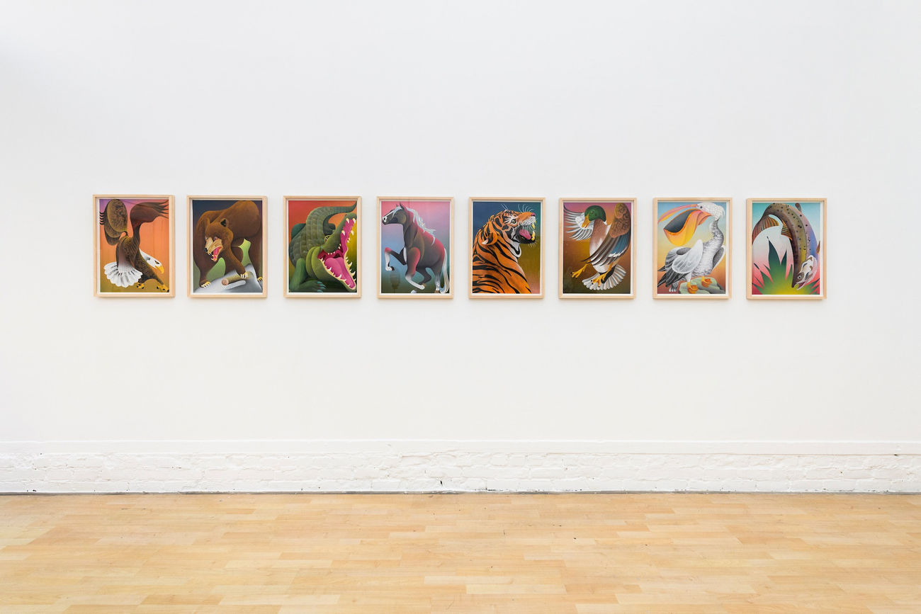 photo of 8 casey gray animal paintings hung on the gallery wall