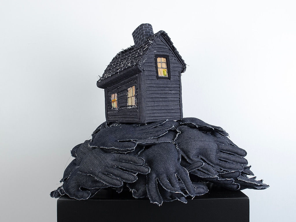 Tania Alvarez sculpture of house on bed of hands