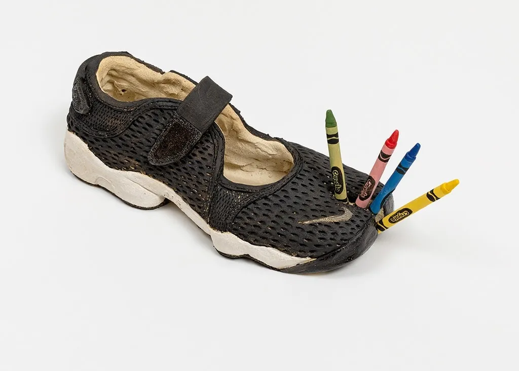 Didi Rojas sculpture of Nike Tabi with crayons