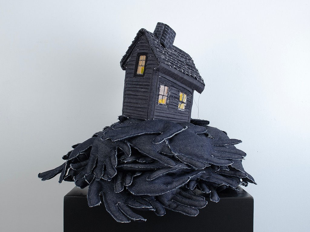 Tania Alvarez sculpture of house on bed of hands
