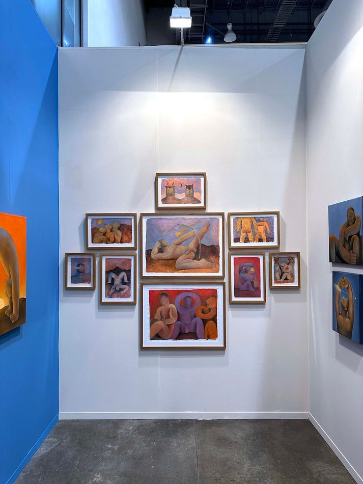installation view of Carlos Rodriguez framed paintings on paper in a cluster