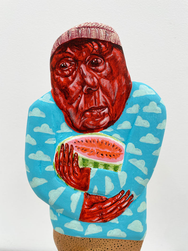 Close of view of the red face side of the sculpture