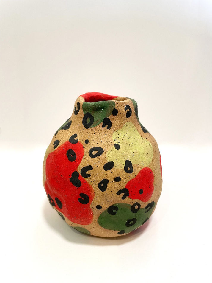 Jackie Brown's vase with cheetah print with green yellow and green shapes