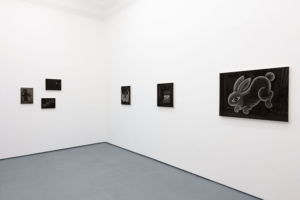 greyscale paintings by Angela Fang Zirbes on white gallery walls