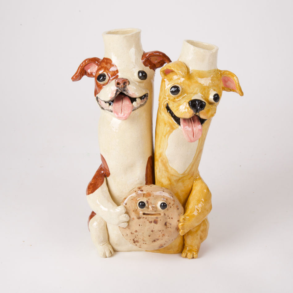 Katie Kimmel vase made out of two dogs holding a cookie