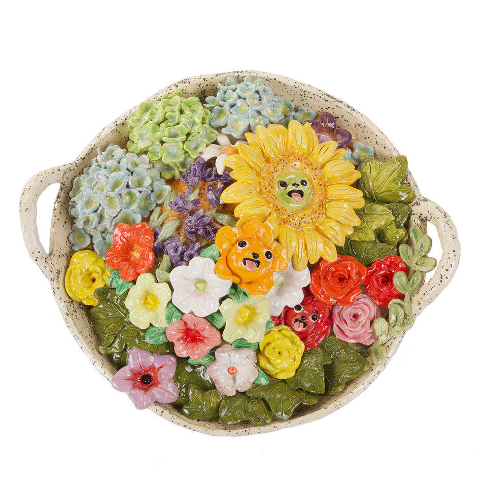 Katie Kimmel's ceramic sculpture of a basket with flowers